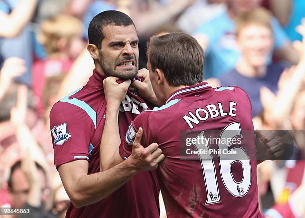 Araujo Ilan of West Ham celebrates with Mark Noble after scoring during the Barclays Premier League match between West Ham United and Wigan Athletic...