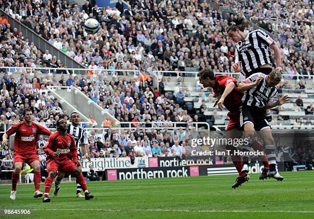 Andy Carroll of Newcastle heads the first goal during the Coca Cola Championship match between Newcastle United and Ipswich Town at St James' Park on...