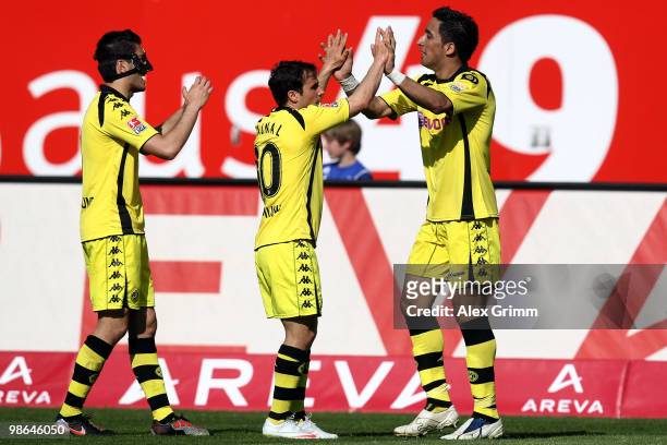 Lucas Barrios of Dortmund celebrates his team's second goal with team mates Tamas Hajnal and Nuri Sahin during the Bundesliga match between 1. FC...