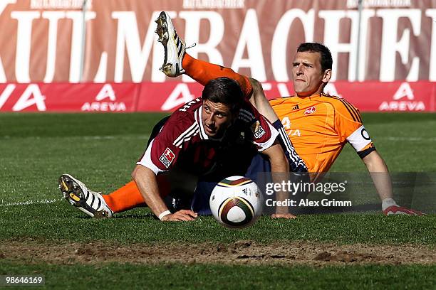 Goalkeeper Raphael Schaefer and Dennis Diekmeier of Nuernberg watch Lucas Barrios of Dortmund on his way to score his team's third goal during the...