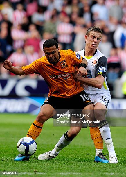 Geovanni of Hull City battles with Jordan Henderson of Sunderland during the Barclays Premier League match between Hull City and Sunderland at the KC...