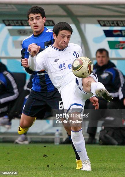 Leandro Fernandez of FC Dynamo Moscow battles for the ball with Emin Mahmudov of FC Saturn Moscow Oblast during the Russian Football League...