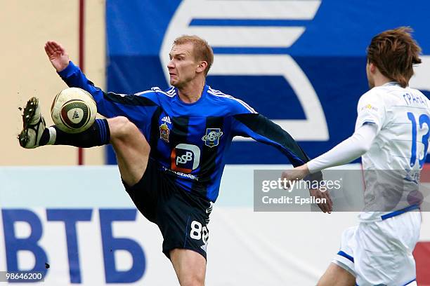 Aleksei Ivanov of FC Saturn Moscow Oblast in action against Vladimir Granat of FC Dynamo Moscow during the Russian Football League Championship match...