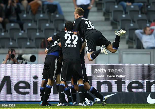 Heiko Westermann of Schalke celebrates with his team mates after scoring his team's first goal during the Bundesliga match between Hertha BSC Berlin...