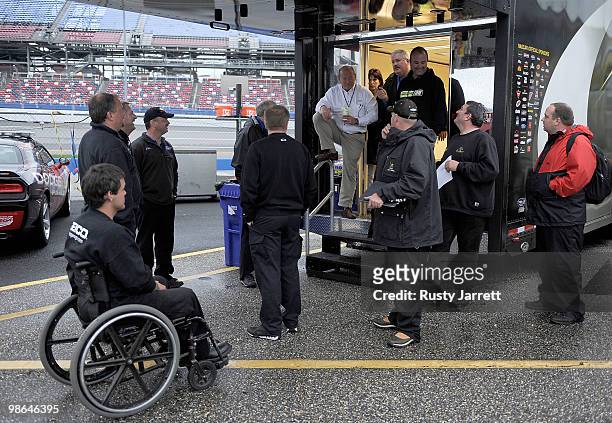Crew chiefs and NASCAR officials gather at the NASCAR Series hauler after all track activites are halted at Talladega Superspeedway on April 24, 2010...
