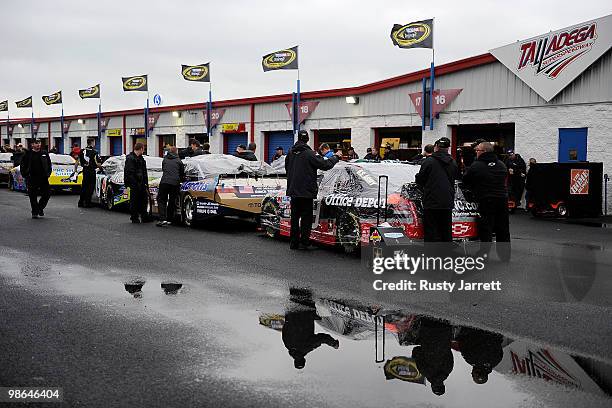 Crews line up for inspection in the garage as all track activities are cancelled due to weather at Talladega Superspeedway on April 24, 2010 in...