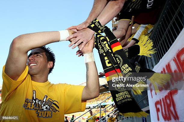 Lucas Barrios of Dortmund celebrates with supporters after the Bundesliga match between 1. FC Nuernberg and Borussia Dortmund at the Easy Credit...