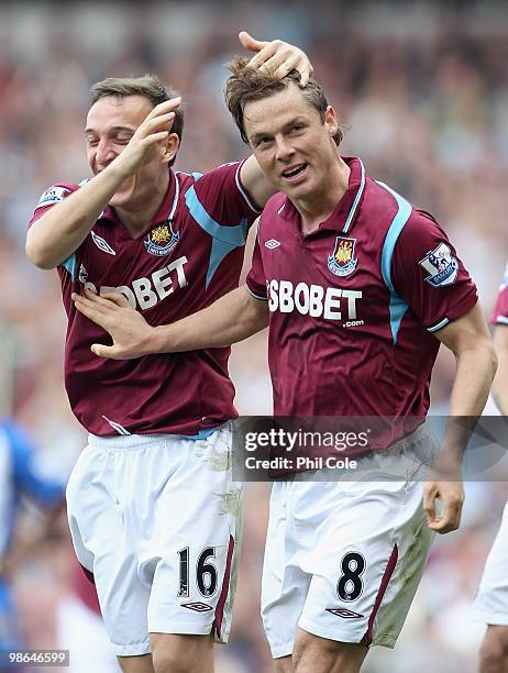 Scott Parker of West Ham celebrates with teammate Mark Noble after scoring the third goal during the Barclays Premier League match between West Ham...