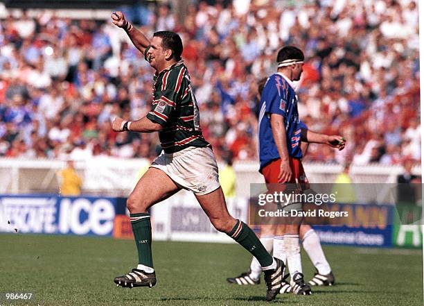 Captain Martin Johnson of Leicester celebrates winning the Heineken Trophy after the match between Stade Francais v Leicester Tigers in the Heineken...