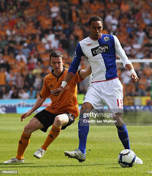 Kevin Foley of Wolverhampton Wanderers tries to tackle Steven Nzonzi of Blackburn Rovers during the Barclays Premier League match between...