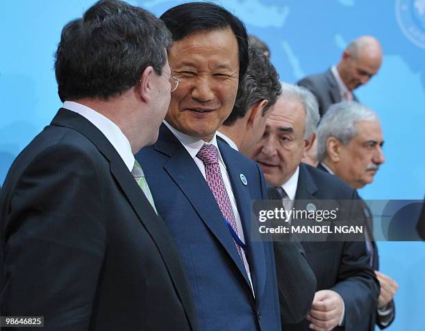 South Korean Finance Minister Yoon Jeung-hyun chats with Canada's Finance Minister Jim Flaherty following the International Monetary and Financial...