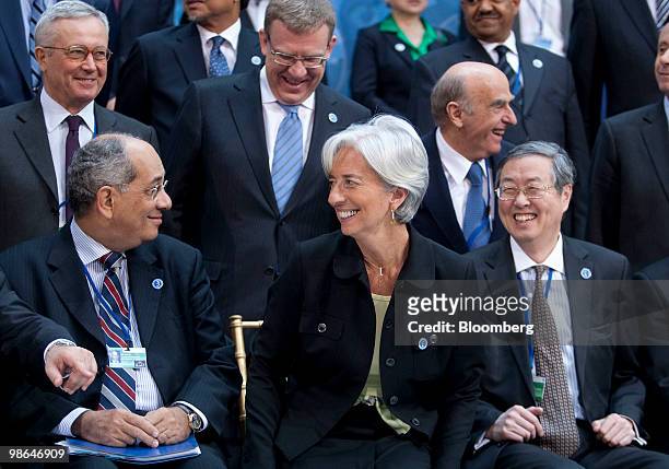 Christine Lagarde, France's finance minister, sits next to Zhou Xiaochuan, governor of the People's Bank of China, right, Youssef Boutros-Ghali,...