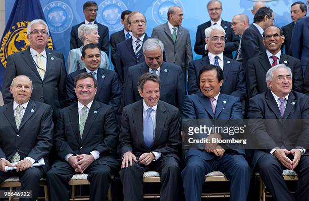 Central bank governors and finance ministers including Guido Mantega, Brazil's finance minister, left to right front row, James Flaherty, Canada's...