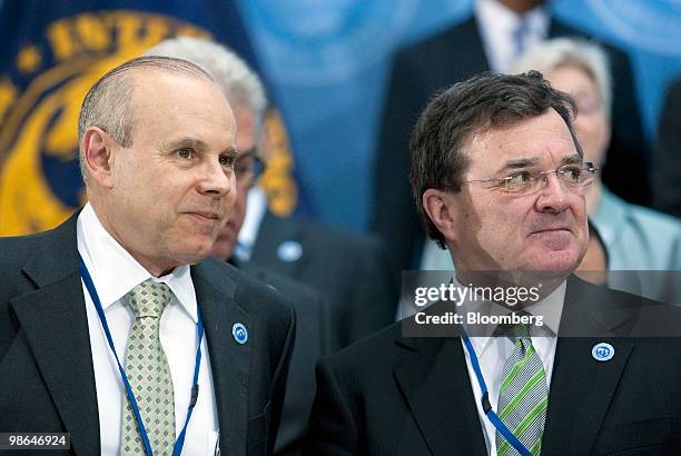 Guido Mantega, Brazil's finance minister, left, and James Flaherty, Canada's finance minister, attend the International Monetary and Financial...