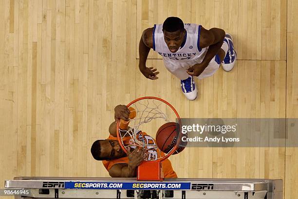 Prince of the Tennessee Volunteers dunks an alley-opp pass against Eric Bledsoe of the Kentucky Wildcats during the semirfinals of the SEC Men's...