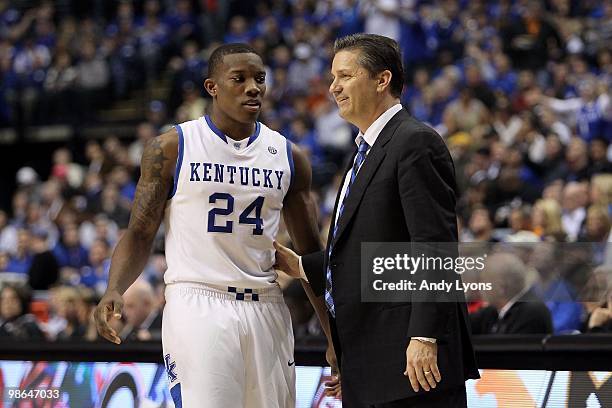 Head coach John Calipari and Eric Bledsoe of the Kentucky Wildcats talk on court against the Tennessee Volunteers during the semirfinals of the SEC...