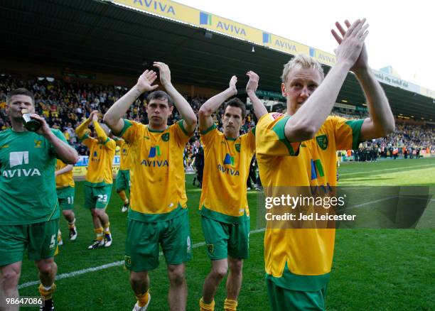 Stephen Hughes of Norwich City celebrates as his team do a lap of honour around the pitch after winning the match and becoming champions of League...