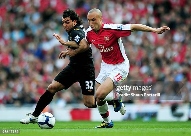 Carlos Tevez of Manchester City Mikael Silvestre of Arsenal battle for the ball during the Barclays Premier League match between Arsenal and...