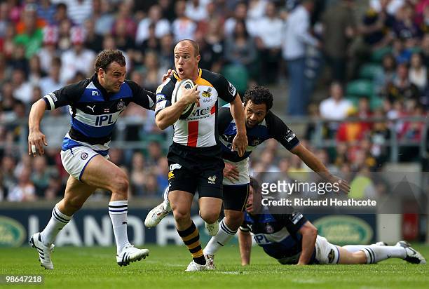Mark van Gisbergen of Wasps tries to get away from Olly Barkley and Joe Maddock of Bath during the Guinness Premiership St George's Day Game between...