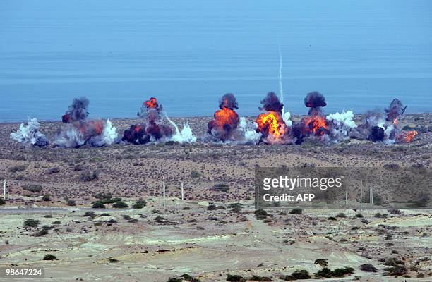 Explosions are pictured during a military drill for the Iranian Revolutionary Guards near the Strait of Hormuz on April 24, 2010. Iran's powerful...