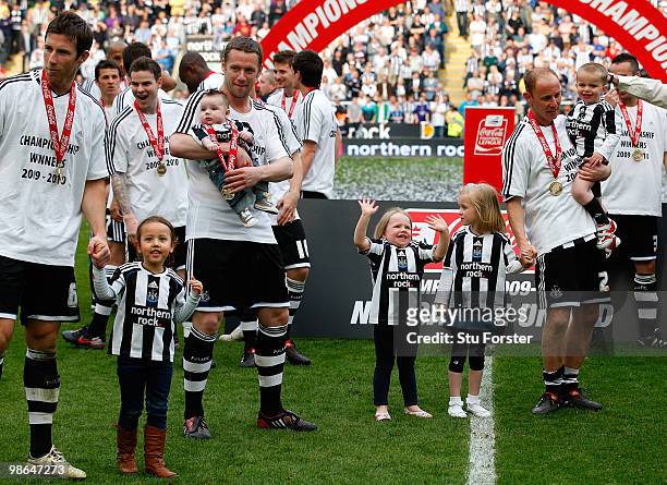Newcastle players Mike Williamson Kevin Nolan and Nicky Butt and their family's wave to the crowd as Newcastle are crowned champions of the...