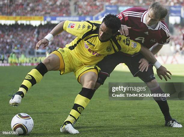 Nuremberg's Argentinian defender Javier Pinola and Dortmund's Argentinian striker Lucas Barrios vie for the ball during the German first division...