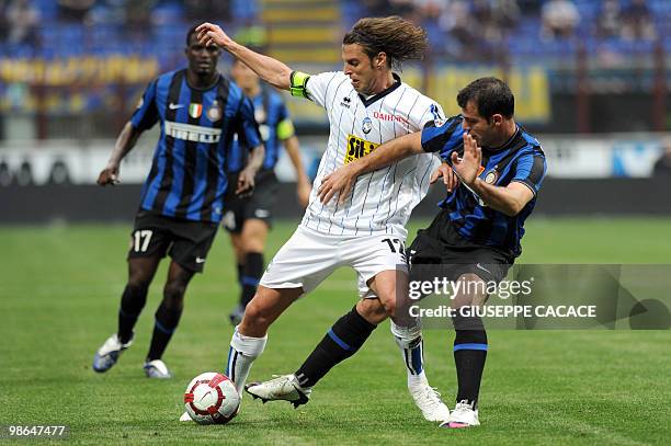 Inter Milan's Serbian midfielder Dejan Stankovic challenges for the ball with Atalanta 's midfielder Cristiano Doni during their Serie A football...