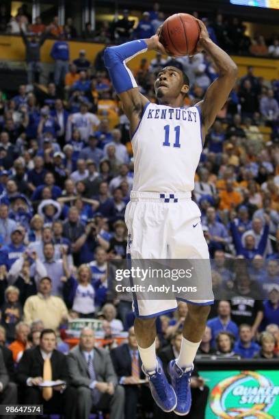 John Wall of the Kentucky Wildcats dunks against the Tennessee Volunteers during the semirfinals of the SEC Men's Basketball Tournament at the...