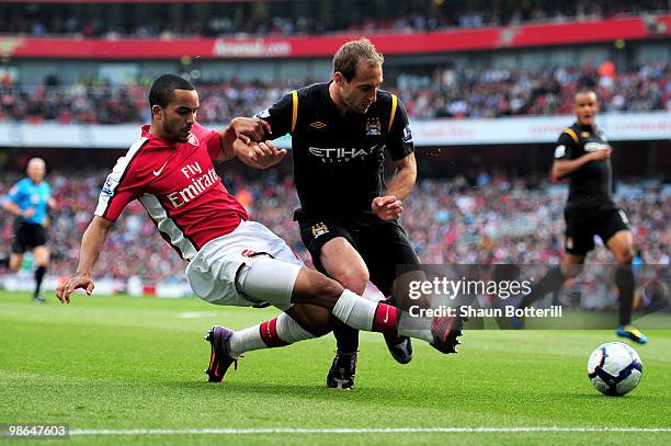 Theo Walcott of Arsenal gets in a cross past Pablo Zabaleta of Manchester City during the Barclays Premier League match between Arsenal and...