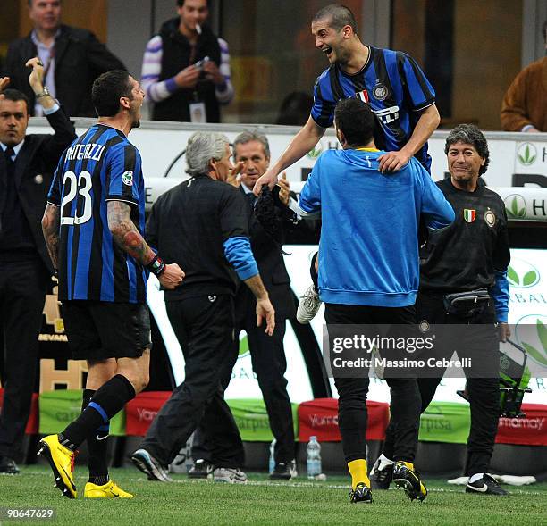 Cristian Chivu of FC Internazionale Milano celebrates scoring his team's third goal with the bench during the Serie A match between FC Internazionale...