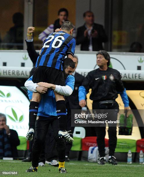 Cristian Chivu of FC Internazionale Milano celebrates scoring his team's third goal with the bench during the Serie A match between FC Internazionale...