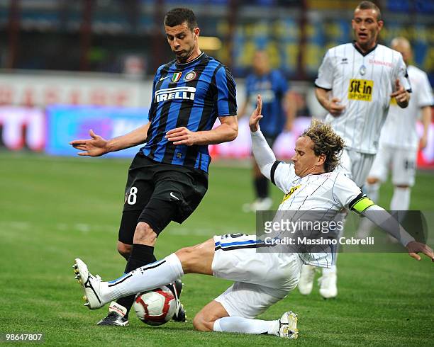 Thiago Motta of FC Internazionale Milano battles for the ball against Thomas Manfredini of Atalanta BC during the Serie A match between FC...