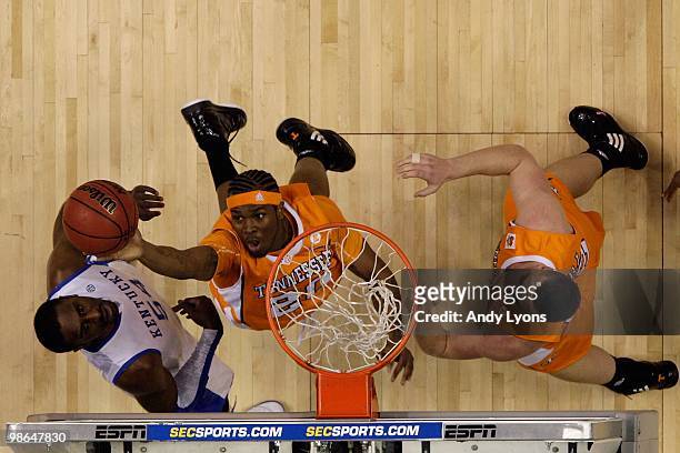 Kenny Hall of the Tennessee Volunteers reaches for a rebound against the Kentucky Wildcats during the semirfinals of the SEC Men's Basketball...