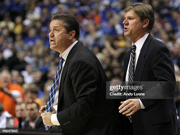 Head coach John Calipari and assistant coach John Robic of the Kentucky Wildcats react against the Tennessee Volunteers during the semirfinals of the...