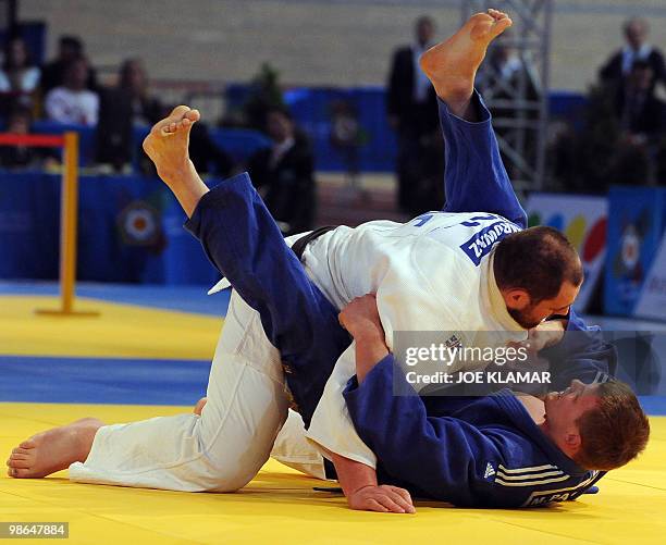 Lituania's Marius Paskevicius and Poland's Janusz Wojnarowicz fight for bronze in thr men's +100 kg event during the European Judo championships in...