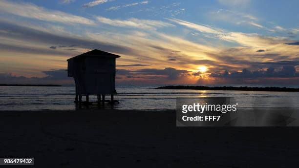 sundawn at netanya beach - netanya stock pictures, royalty-free photos & images