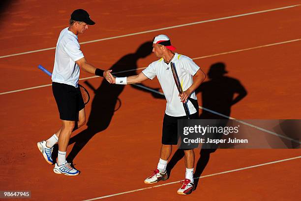 Mark Knowles of the Bahamas and Lleyton Hewitt of Australia celebrate a point over Mariusz Fyrstenberg and Marcin Matkowski of Poland during the semi...