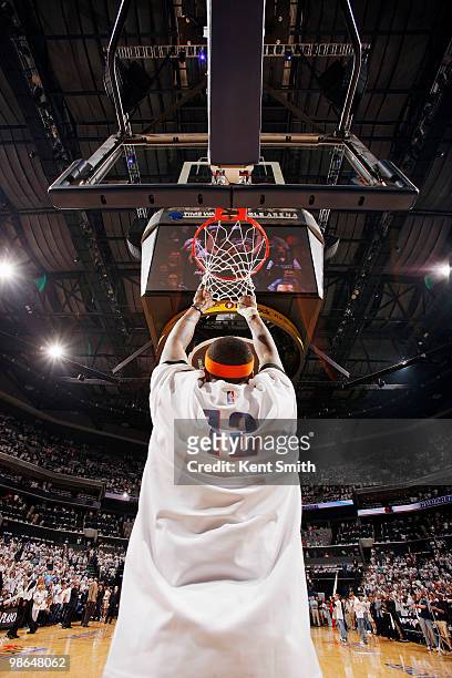 Tyrus Thomas of the Charlotte Bobcats grabs the net before the game against the Orlando Magic in Game Three of the Eastern Conference Quarterfinals...