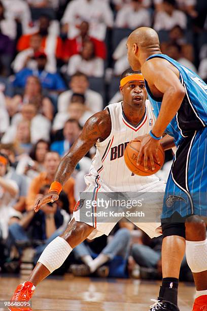 Stephen Jackson of the Charlotte Bobcats guards against Vince Carter of the Orlando Magic in Game Three of the Eastern Conference Quarterfinals...