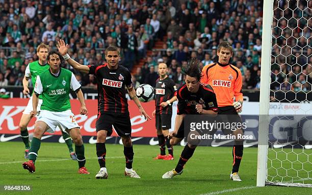 Pedro Geromel of Koeln stops the ball with the hand during the Bundesliga match between Werder Bremen and 1. FC Koeln at Weser Stadium on April 24,...