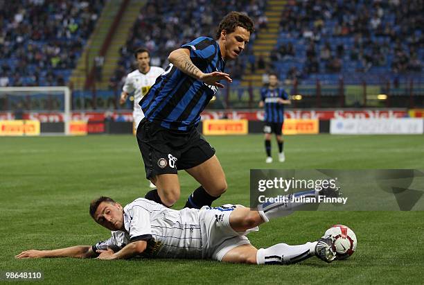 Marko Arnautovic of Inter is tackled by Daniele Capelli of Atalanta during the Serie A match between FC Internazionale Milano and Atalanta BC at...