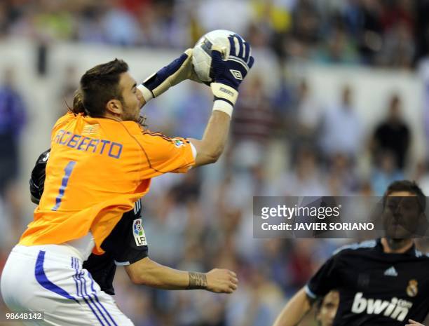 Zaragoza's goalkeeper Roberto fights for the ball against Real Madrid's midfielder Xabi Alonso during the Spanish League football match Zaragoza...