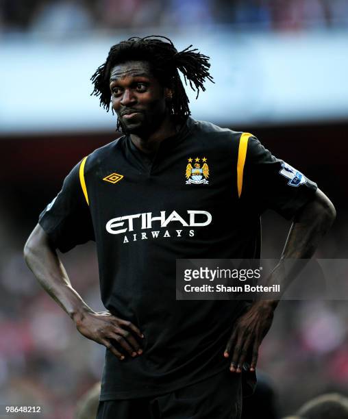 Emmanuel Adebayor of Manchester City looks on during the Barclays Premier League match between Arsenal and Manchester City at the Emirates Stadium on...