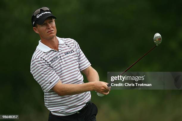 John Senden of Australia tees off on the 5th hole during the continuation of the weather delayed second round of the Zurich Classic at TPC Louisiana...