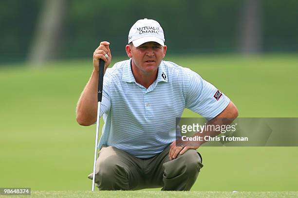 Jason Bohn lines up a putt on the 13th hole during the continuation of the weather delayed second round of the Zurich Classic at TPC Louisiana on...