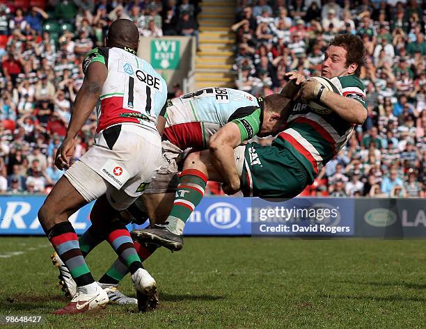 Johne Murphy of Leicester is tackled by Mike Brown during the Guinness Premiership match between Leicester Tigers and Harlequins at Welford Road on...