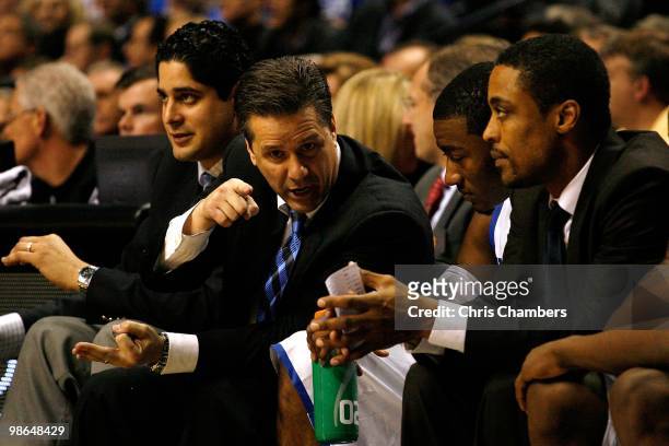 Head coach John Calipari, John Wall and assistant coach Rod Strickland of the Kentucky Wildcats talk on the bench against the Tennessee Volunteers...