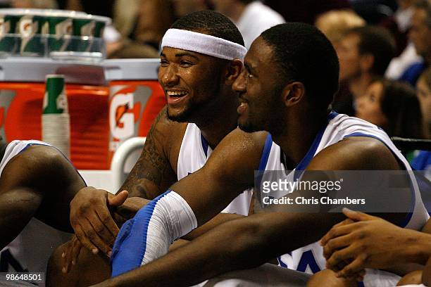 DeMarcus Cousins and Patrick Patterson of the Kentucky Wildcats support their teammates from the bench against the Tennessee Volunteers during the...