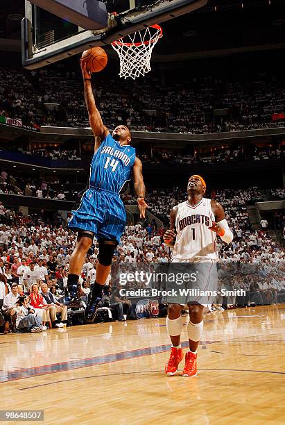 Jameer Nelson of the Orlando Magic goes for the layup against Stephen Jackson of the Charlotte Bobcats in Game Three of the Eastern Conference...
