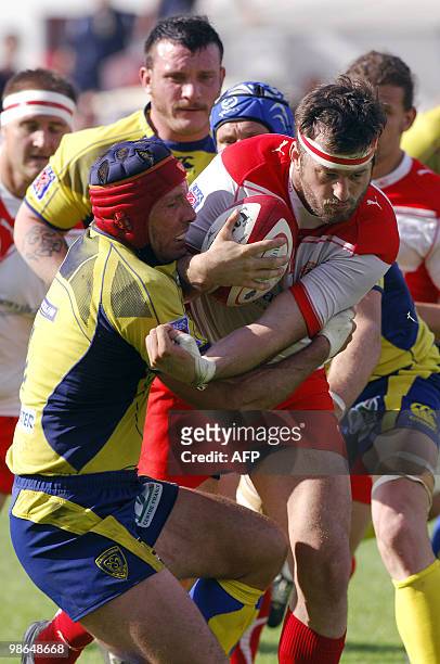 Biarritz lock Florian Faure is tackled by Clermont-Ferrand's player Alexandre Audebert during the French Top 14 rugby union match Biarritz vs....